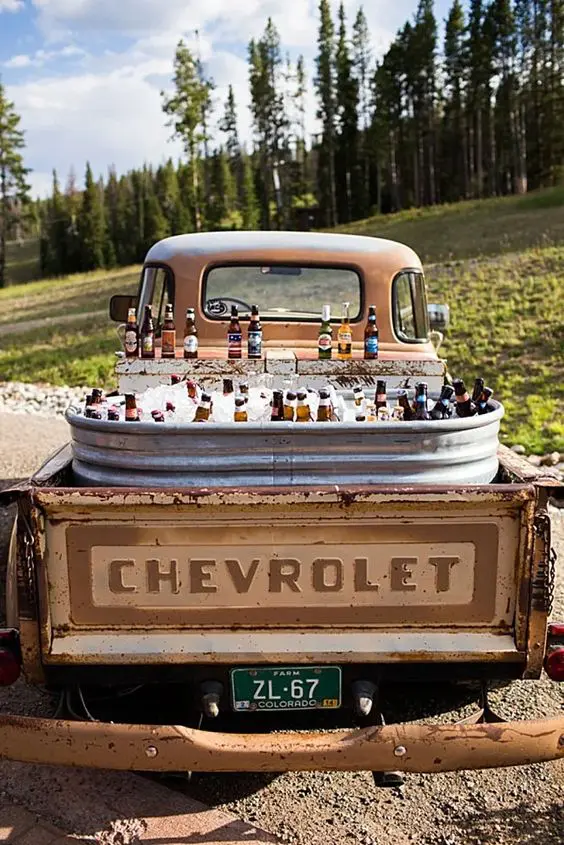 an epic wedding drink station in an old chevrolet is a lovely idea for a very rustic wedding, it's creative and will save your budget