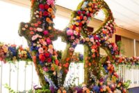 awesome oversized letters covered with moss and all colors and kinds of blooms look just jaw-dropping