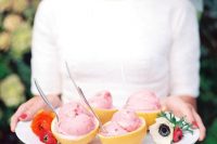 citrus cups with fresh ice cream and blooms on the tray is a lovely and creative way to serve ice cream easily