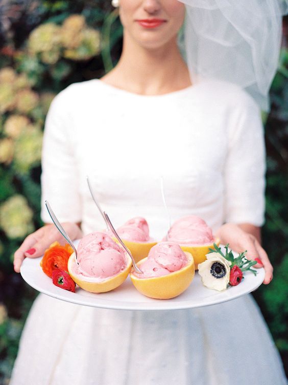 citrus cups with fresh ice cream and blooms on the tray is a lovely and creative way to serve ice cream easily
