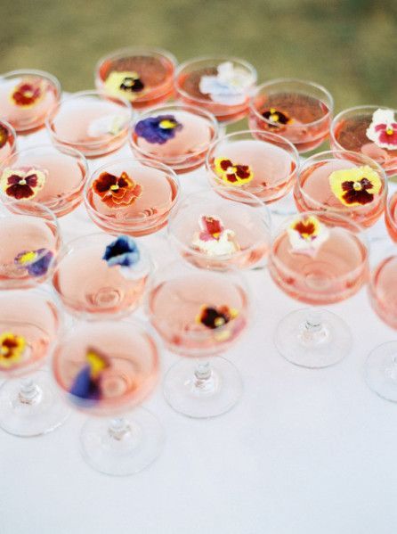 cocktails with pansies are amazing for a spring or summer wedding in a garden