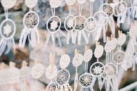 mini wedding favors that double as escort cards – dream catchers with cards are cool and cute