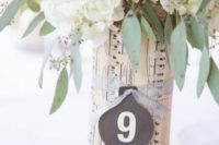 wrap your vase with note paper, secure it with a ribbon and add a chalkboard table number
