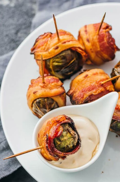 Brussels sprouts wrapped with bacon and with a tasty dip are very hearty fall wedding appetizers