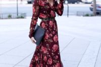 a burgundy floral maxi dress with long sleeves, V-neckline, a belt, nude shoes and a clutch