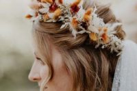 a creative boho fall crown of white and colorful bunny tails and white dried foliage is a fantastic idea for a fall boho bride