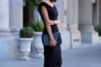 a fail-proof look with a black midi fitting dress, a black clutch and blakc strappy heels