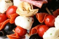 a fresh take on Caprese skewers with tomatoes, olives, mozzarella, ham is a very hearty fall appetizer idea