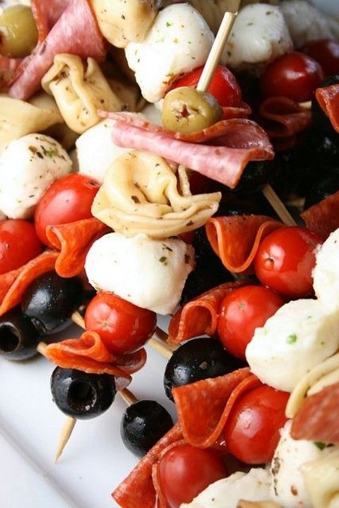 a fresh take on Caprese skewers with tomatoes, olives, mozzarella, ham is a very hearty fall appetizer idea