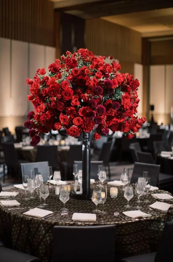 a lush and beautiful red rose wedding centerpiece with burgundy dahlias is a stunning idea for a Valentine's Day