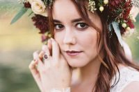 a moody fall bridal crown with blush and burgundy blooms, berries, greenery and seed pods is a very fresh idea