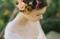 a moody fall floral crown with purple and peachy blooms and lots of textural greenery is a cool idea