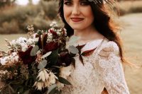a moody floral crown with pink, blush, burgundy, deep purple, rust blooms and greenery and herbs is a lovely idea for a fall bride