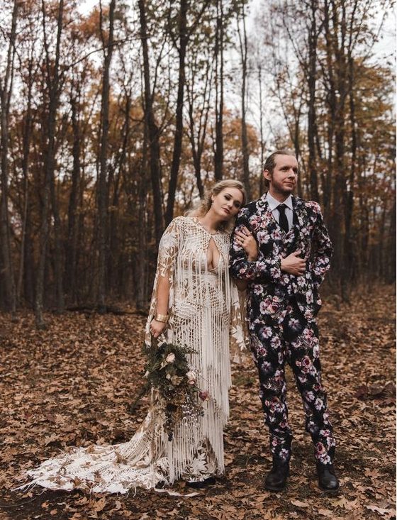 a moody floral print three-piece wedding suit, a black tie and a white shirt, black shoes