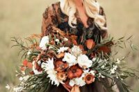 a moody wedding bouquet done in the shades of brown and rust plus white blooms and neutral ribbons