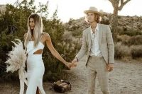 a neutral boho groom’s look with a greige windowpane suit, a white shirt, white trainers and a hat is great for a desert wedding
