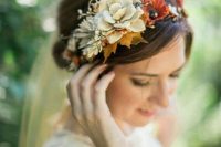 a pretty fall floral crown with rust and neutral blooms, neutral succulents and bright fall leaves is a cool idea