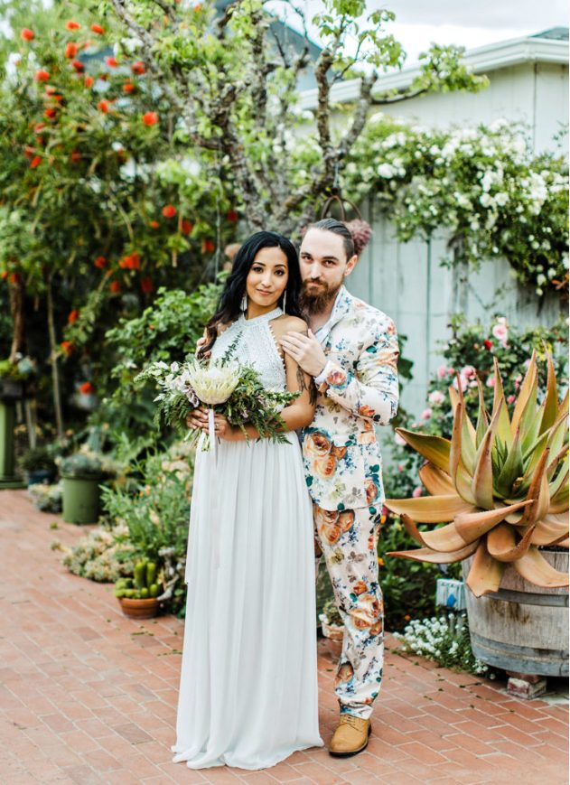 a super colorful floral suit with a white shirt and no tie, amber shoes for a colorful tropical wedding