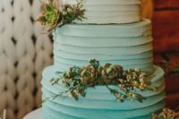 a textural and ombre tiffany blue wedding cake decorated with succulents and little blooms is a bold idea
