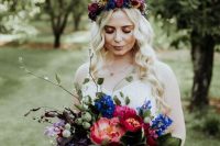 a vibrant jewel-tone wedding crown of purple, blue and yellow blooms is a very lovely and bold idea to rock