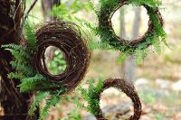 an arrangement of fall wedding wreaths composed of twine and ferns is a great idea for a woodland wedding, not only a fall one