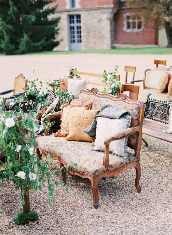 antique love seats, benches, and statement chairs made a statement at this vintage-inspired wedding