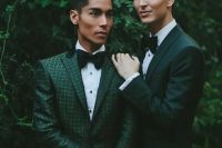 beautiful green pantsuits, a dark green one and a green printed one, white shirts and black bow ties for a cohesive couple’s look