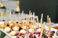 cheese balls with fresh herbs, nuts and veggies on skewers are simple and cool Valentine wedding appetizers to try