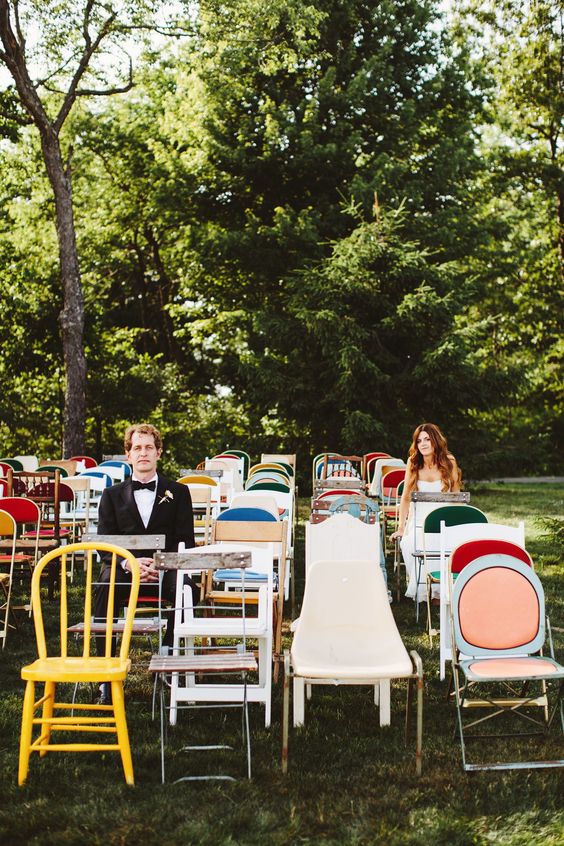 colorful mismatching chairs are great for a super relaxed, fun, backayrd wedding and they won't break the budget