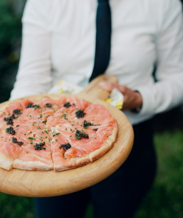 delicious salmon pizza topped with caviar is a fantastic wedding appetizer idea that will make everyone happy