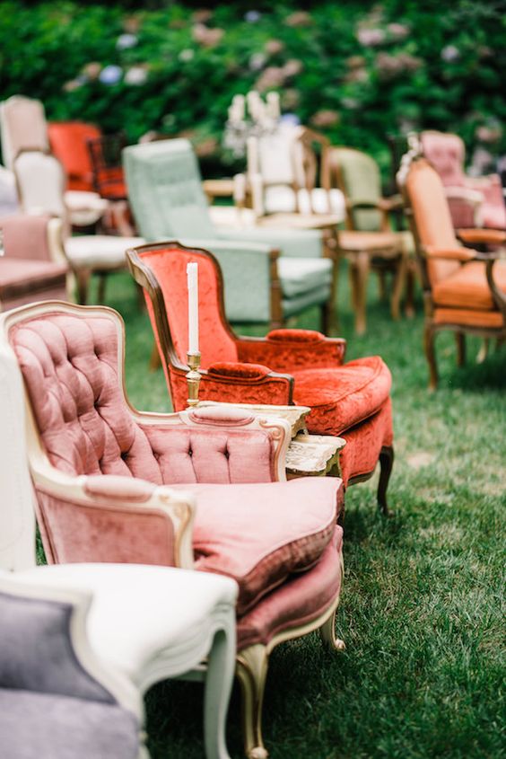 lovely colorful mismatching vintage chairs with and without armrests will be a great idea for an elegant wedding with vintage flare