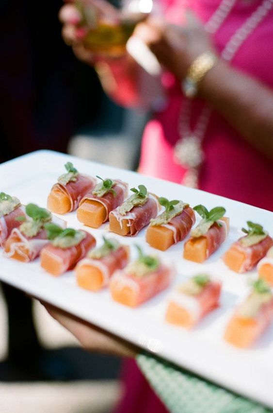 peaches wrapped with bacon and topped with herbs are amazing for summer weddings