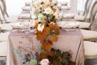 refined fall wedding table decor with neutral and pink roses, allium, greenery and bold fall leaves is an adorable idea for the fall