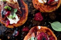 roasted sweet potato rounds are loaded with vegan goat cheese, cranberries and balsamic glaze