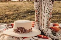 rustic and boho bridal accessories – painted and embroidered tall cowboy boots, a matching hat, a pretty coverup will make any bridal look very rustic