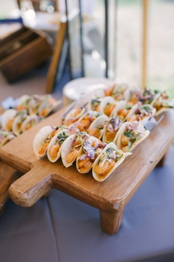 shrimp mini tacos topped with edible blooms are tasty cocktail hour wedding appetizers