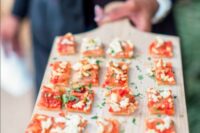 tiny pizza bites reminiscent of pizza bagels made the rounds during cocktail hour