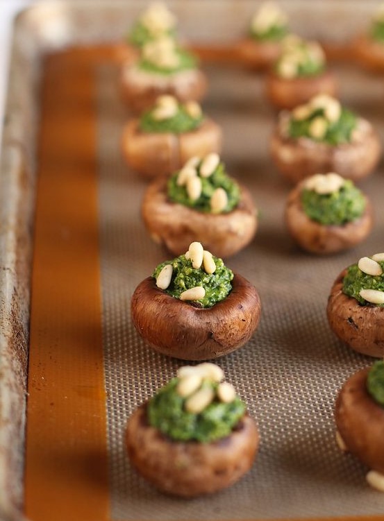 vegan pesto stuffed mushrooms with nuts on top are a great idea of bite-size food