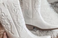 white embroidered cowgirl boots like these ones will be a perfect solution for a modern boho bridal look or for pulling off a rustic one