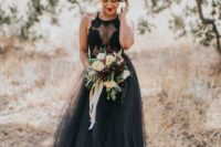 a black lace halter neckline top and a black tulle skirt for a Halloween bridal look