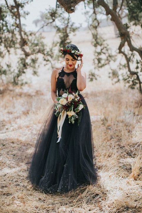 a black lace halter neckline top and a black tulle skirt for a Halloween bridal look