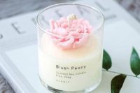 a blush peony soy scented candle is a cool favor or decoration for a spa bridal shower