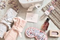 a chic bride’s gift box with a sleep mask, towels, dried flower petals, a soap are a chic setup for a bride