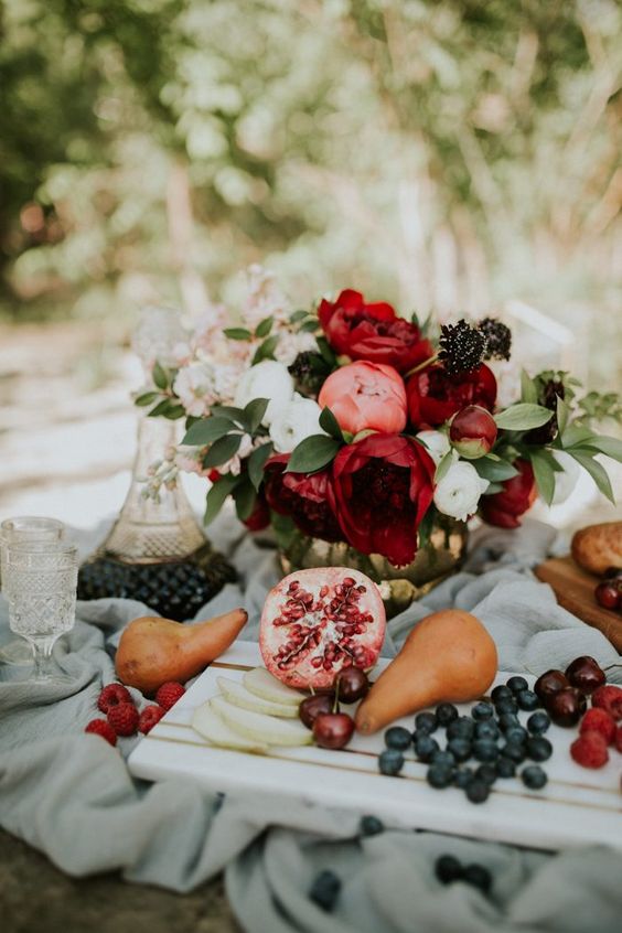 a fall wedding platter with berries and fresh fruit including pomegranates is a fantastic idea for a bright fall wedding