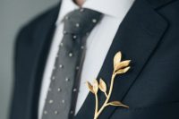 a gilded branch with leaves is a very elegant and whimsical accessory to refresh your look