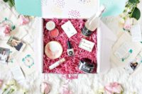 a glam box with champagne, lip gloss, lipsticks, a soap and some other cute stuff to look wow