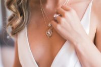 a gorgeous crystal drop layered necklace will fit a plunging neckline wedding dress