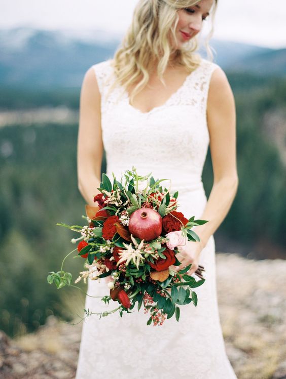a playful fall wedding bouquet of greenery, neutral, burgundy and blush blooms, foliage and twigs is a great idea for the fall