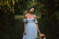 a powder blue off the shoulder wedding dress with tulle sleeves and skirt plus an embroidered bodice
