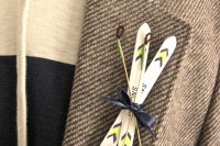 a ski boutonniere is a fun and quirky accessory for a ski-loving wedding and groom